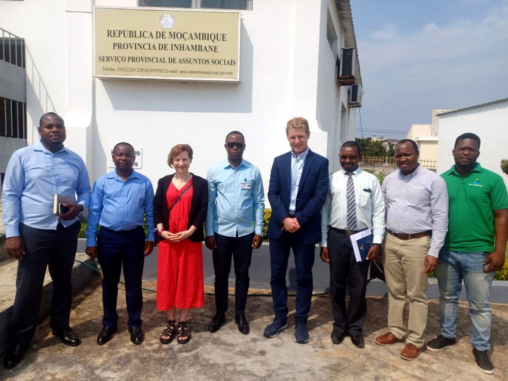 Staff from SERC and from a partner college in Mozambique outside the college building